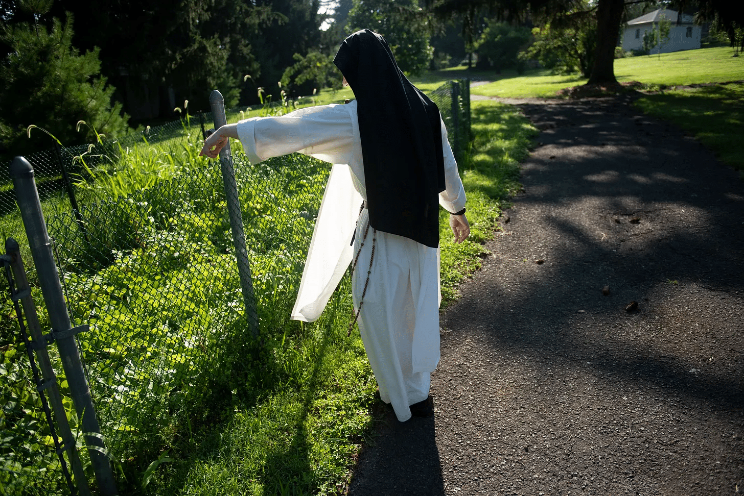 Dominican Nun pointing to garden copy